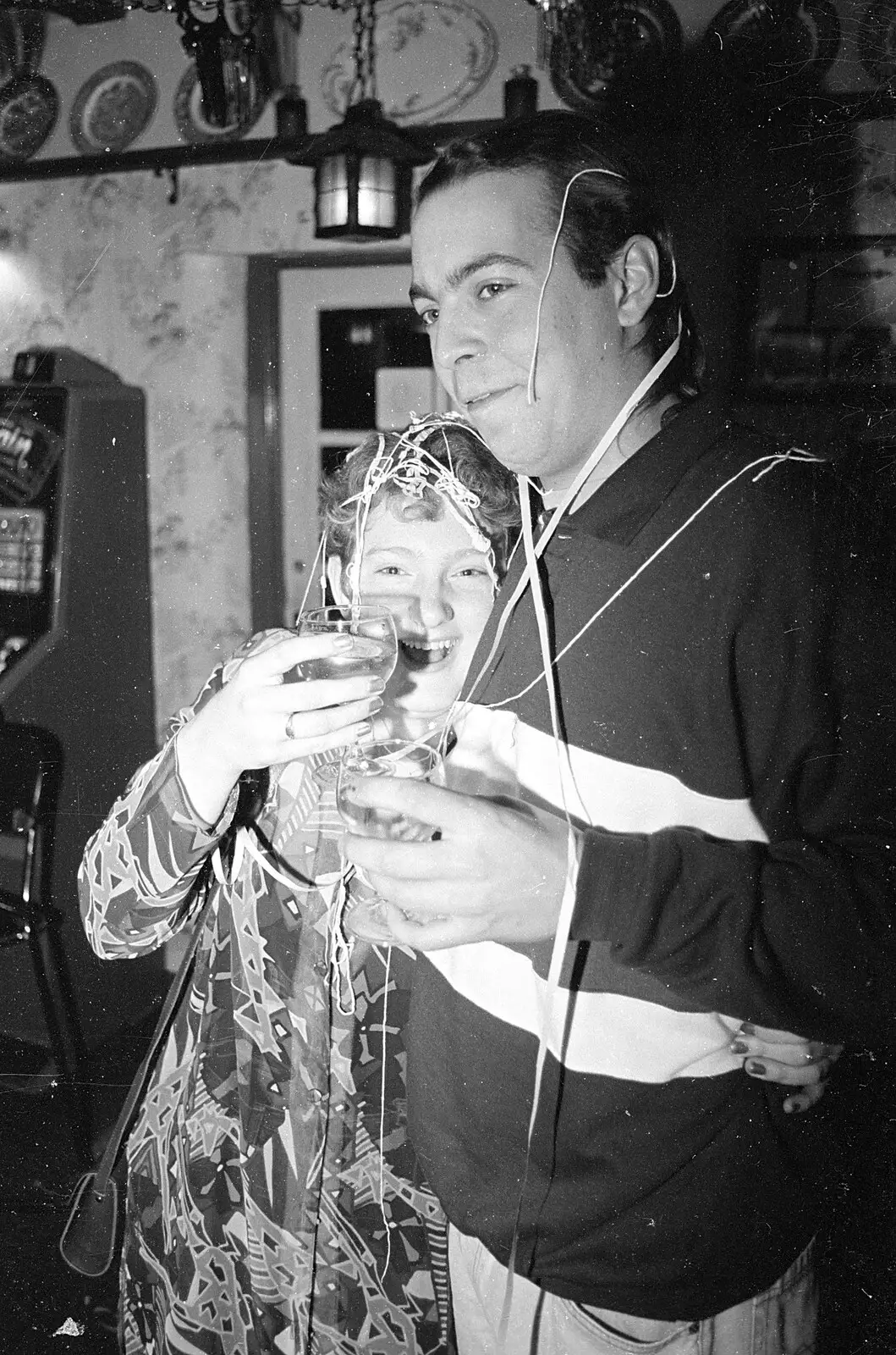 Sally and Doug are covered in streamers, from New Year's Eve at the Swan Inn, Brome, Suffolk - 31st December 1992