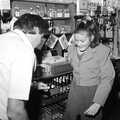 Alan and Claire dance behind the bar, New Year's Eve at the Swan Inn, Brome, Suffolk - 31st December 1992