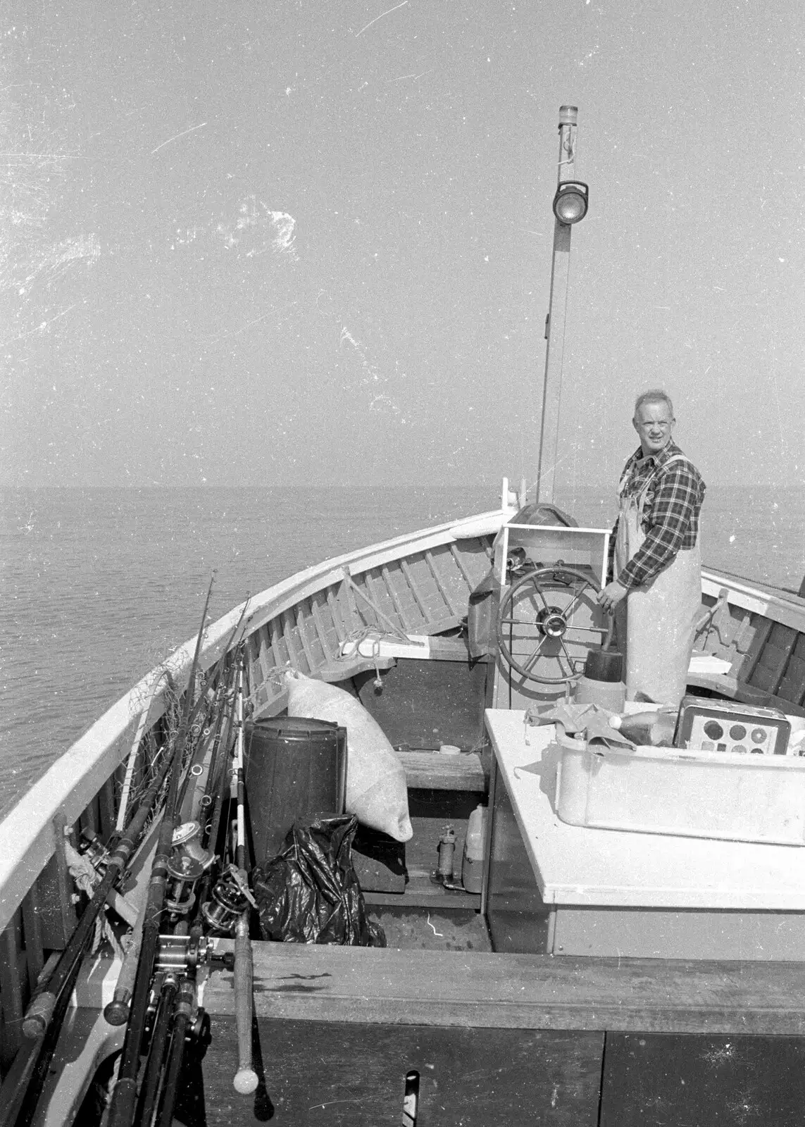 David looks back from the helm, from A Fishing Trip on the Linda M, Southwold, Suffolk - 25th April 1993