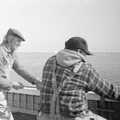 Peter and Ben start to haul the nets in, A Fishing Trip on the Linda M, Southwold, Suffolk - 25th April 1993