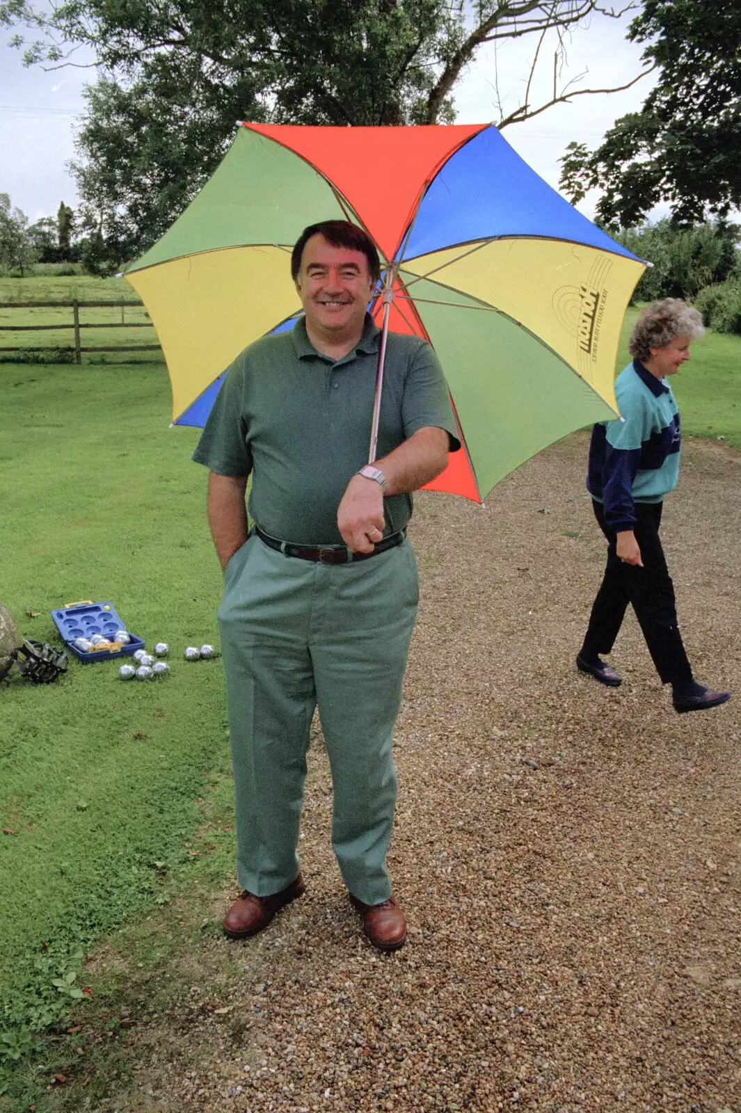 Corky shelters under an umbrella, from Mel Visits and a bit of Clays, Stuston and Bungay, Suffolk - 19th June 1993