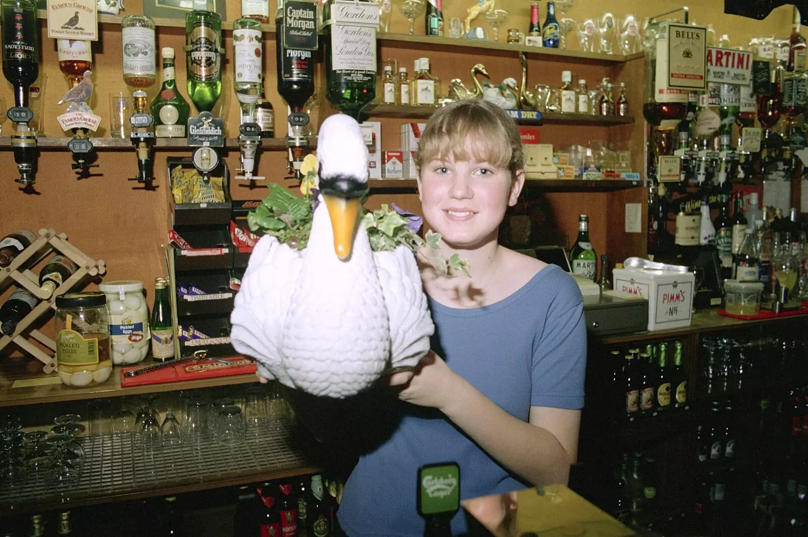 Lorraine holds up a ceramic swan, from A Night In The Swan Inn, Brome, Suffolk - 1st November 1993