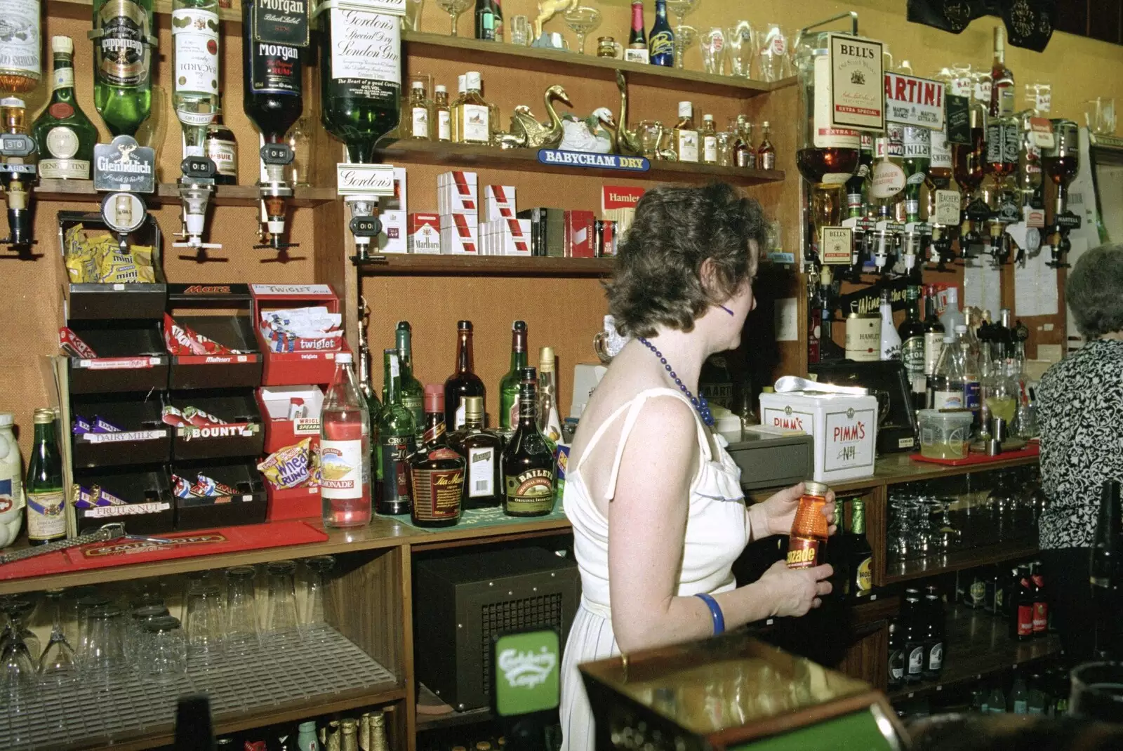 Sylvia wanders off with a bottle of Lucozade, from A Night In The Swan Inn, Brome, Suffolk - 1st November 1993