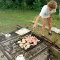 Brenda turns some sausages, A Geoff and Brenda Barbeque, Stuston, Suffolk - 3rd April 1994