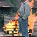Bernie considers the towering inferno of pallets, A Geoff and Brenda Barbeque, Stuston, Suffolk - 3rd April 1994