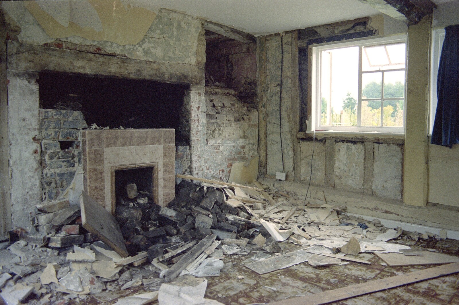 The original inglenook fireplace is found from Moving In, Brome, Suffolk - 10th April 1994