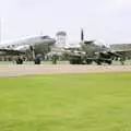 A Douglas DC3 'Dakota' and a taxiing Spitfire, The Mildenhall Air Fete, Mildenhall, Suffolk - 29th May 1994