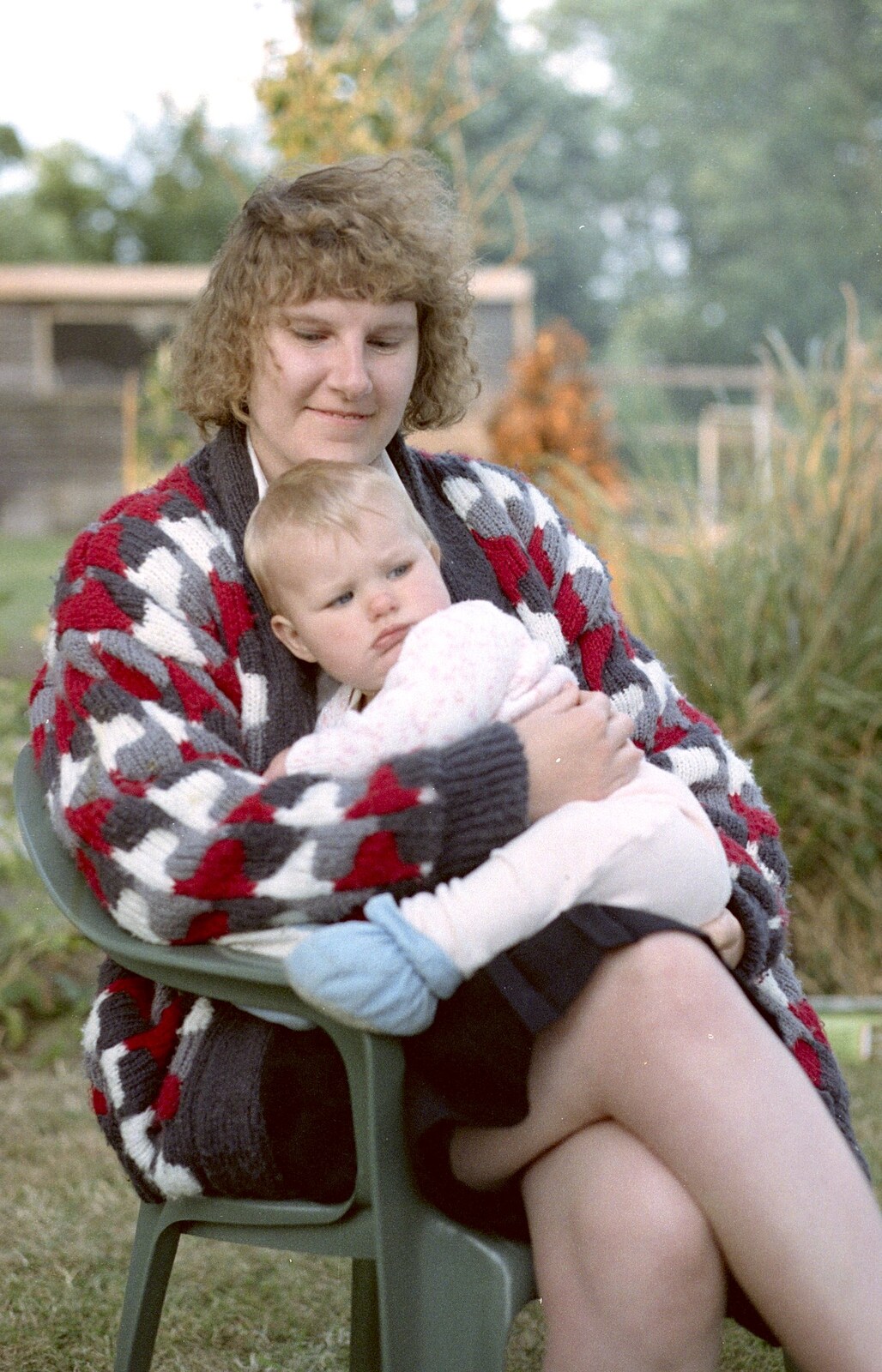 Another sprog gets a cuddle from Sarah's Birthday Barbeque, Burston, Norfolk - 7th June 1994