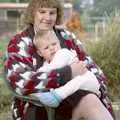 Another sprog gets a cuddle, Sarah's Birthday Barbeque, Burston, Norfolk - 7th June 1994