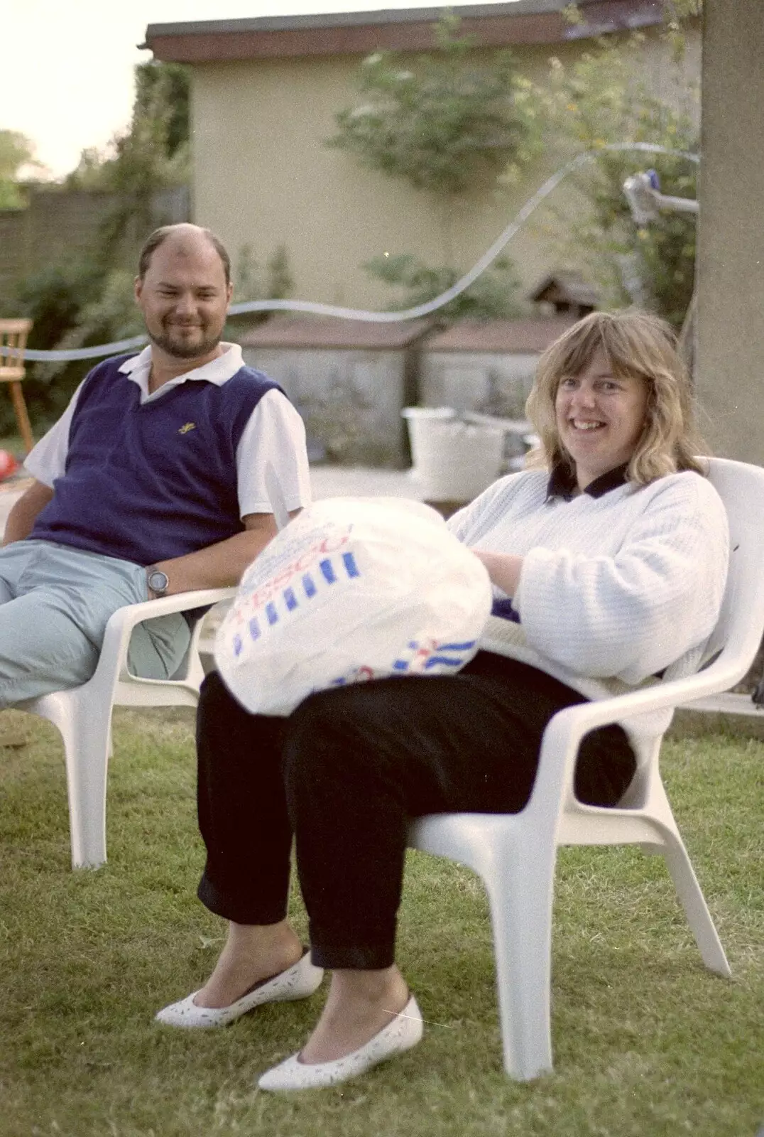 Sarah's got a birthday cake in a Tesco bag, from Sarah's Birthday Barbeque, Burston, Norfolk - 7th June 1994