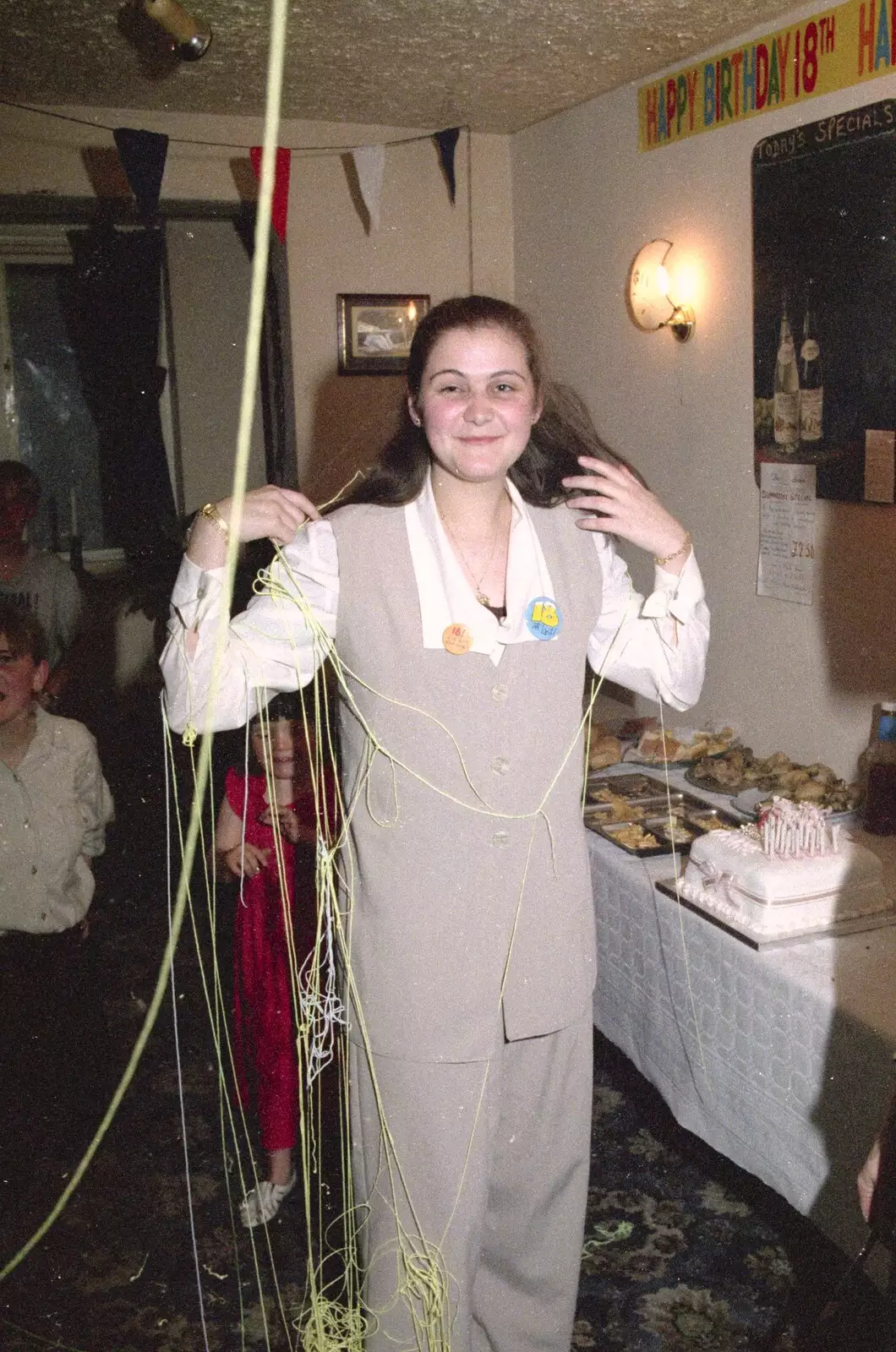 Claire sweeps away string-in-a-can, from Claire's Eighteenth Birthday, The Swan Inn, Brome, Suffolk - 11th June 1994