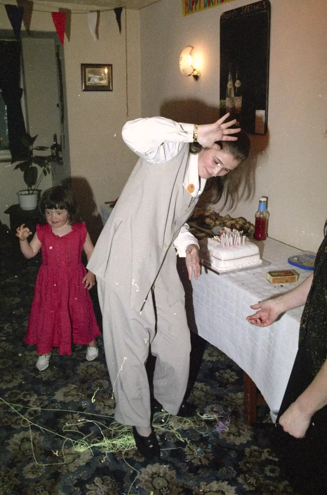 Claire fends off some silly string, from Claire's Eighteenth Birthday, The Swan Inn, Brome, Suffolk - 11th June 1994