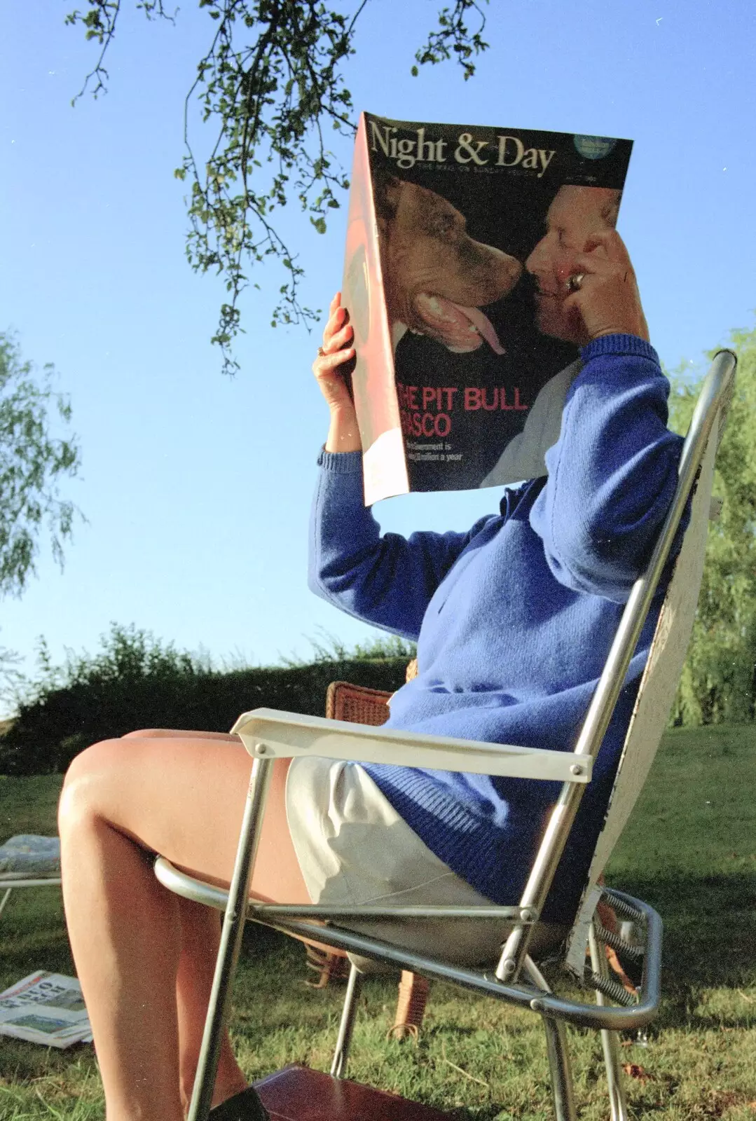 Brenda hides behind a magazine, from "Mad" Sue's 50th and the Building of the Stuston Bypass, Stuston, Suffolk - 7th July 1994