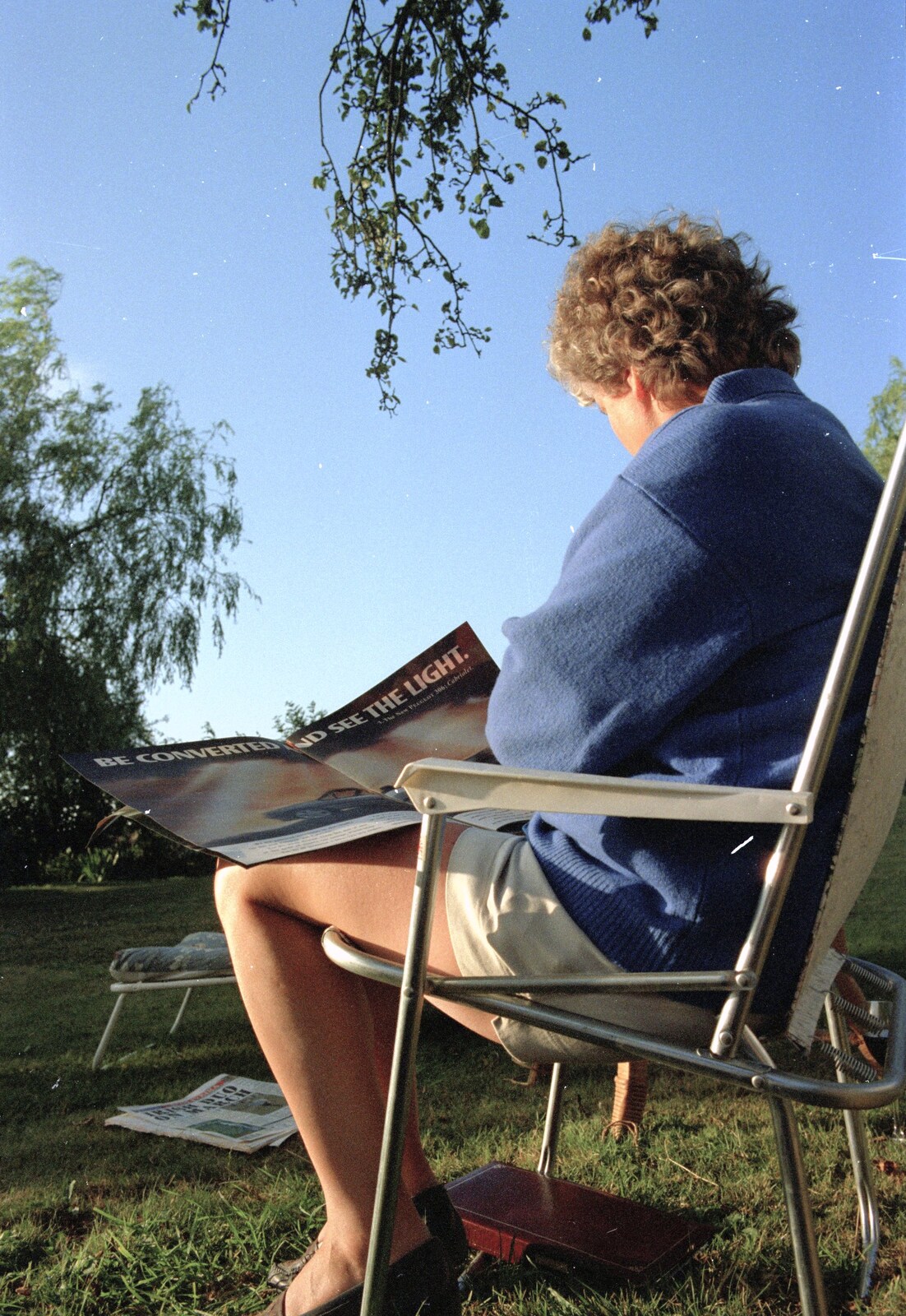 Brenda reads a magazine from "Mad" Sue's 50th and the Building of the Stuston Bypass, Stuston, Suffolk - 7th July 1994