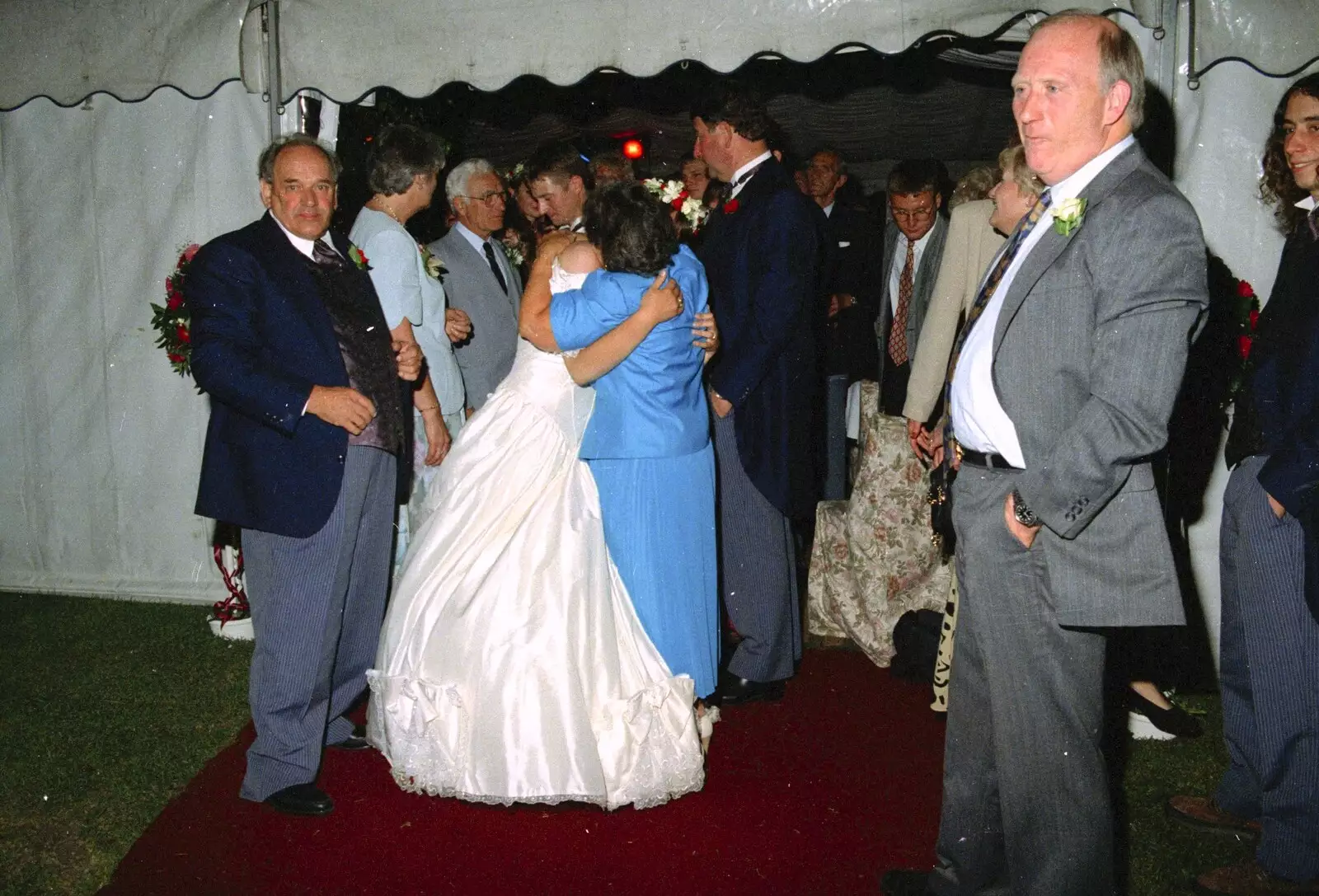 Lisa gets hugs on the way out, from Bernie's Anniversary and Charlie's Wedding, Palgrave and Oakley, Suffolk - 19th July 1994