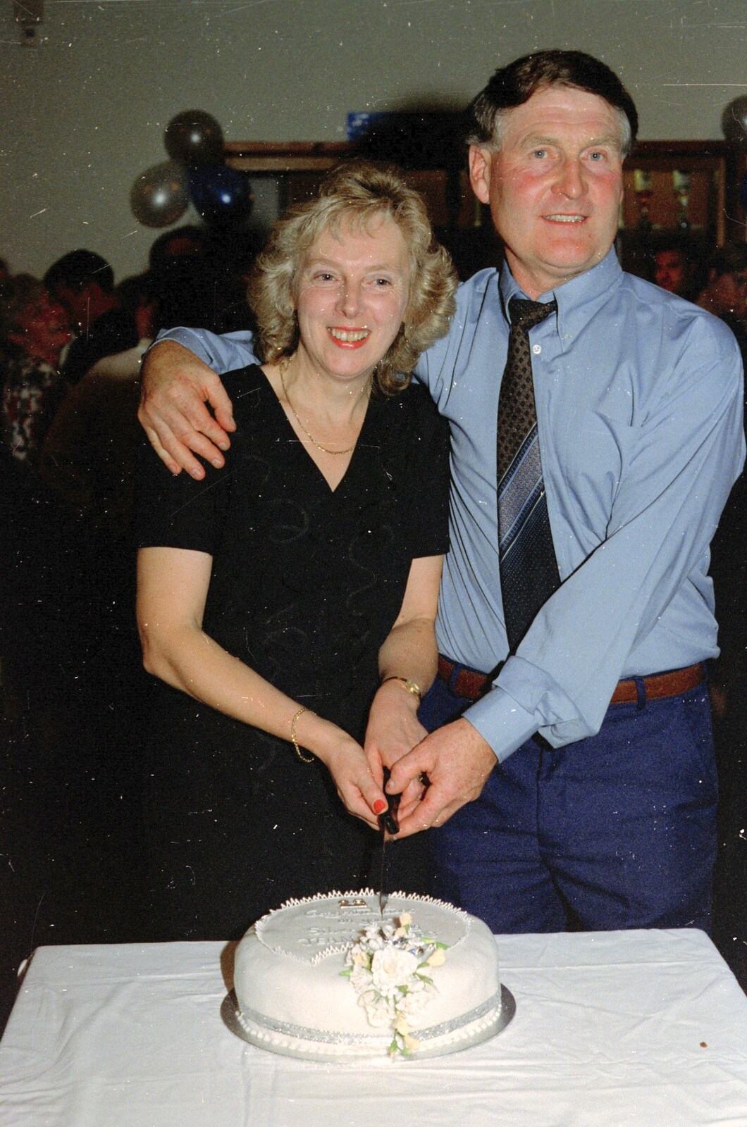 Jean and Bernie cut a cake from Bernie's Anniversary and Charlie's Wedding, Palgrave and Oakley, Suffolk - 19th July 1994