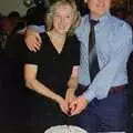 Jean and Bernie cut a cake, Bernie's Anniversary and Charlie's Wedding, Palgrave and Oakley, Suffolk - 19th July 1994