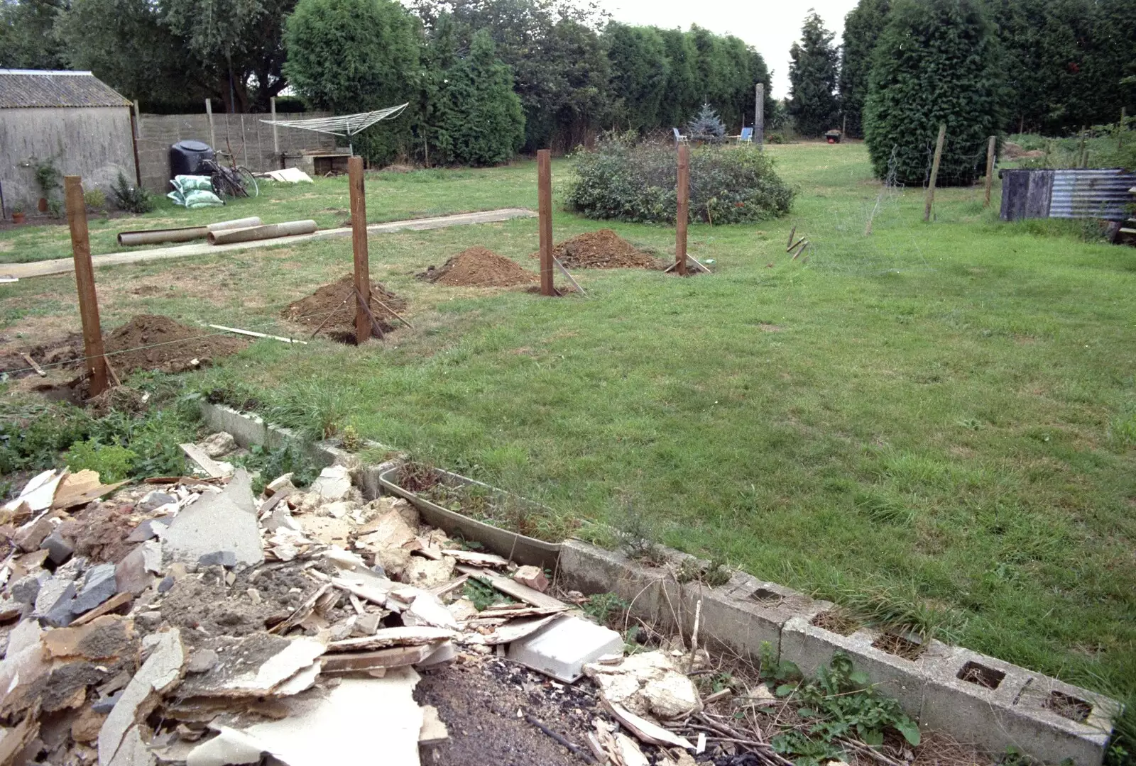 The next-door neighbours build a new fence, from A Stripper at The Swan, Brome, Suffolk - 30th August 1994