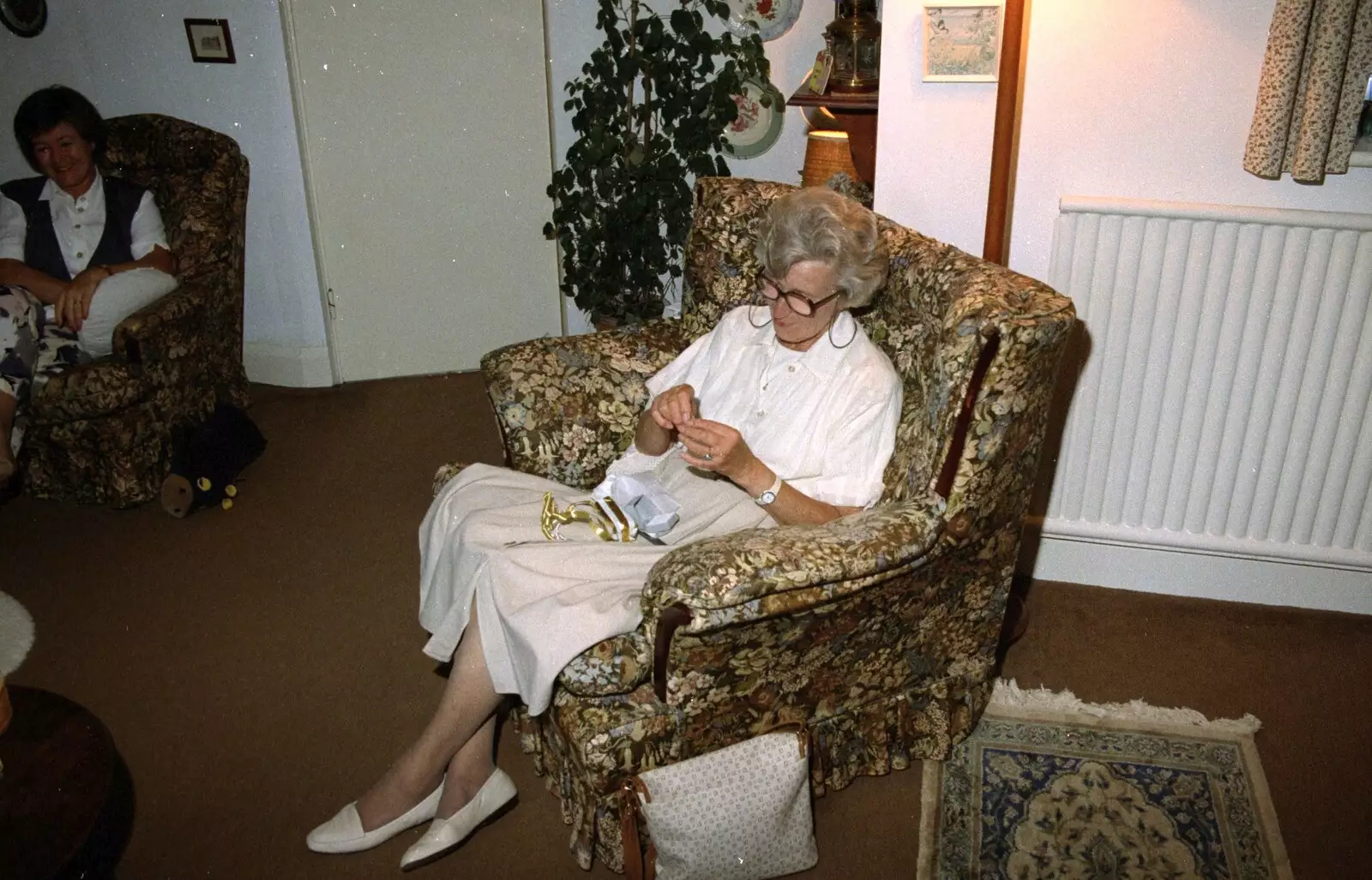 Granmother opens a present, from Grandmother's Seventieth Birthday, Brockenhurst and Keyhaven, Hampshire - 11th September 1994