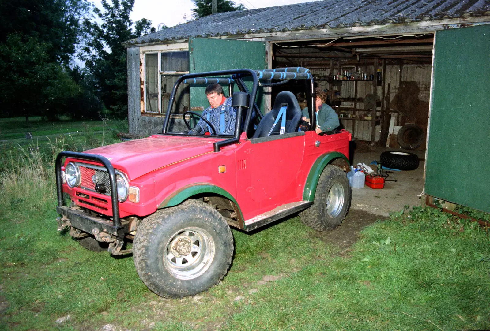 Corky drives the Daihatsu out of the shed, from Off-Roading With Geoff and Brenda, Suffolk - 10th October 1994