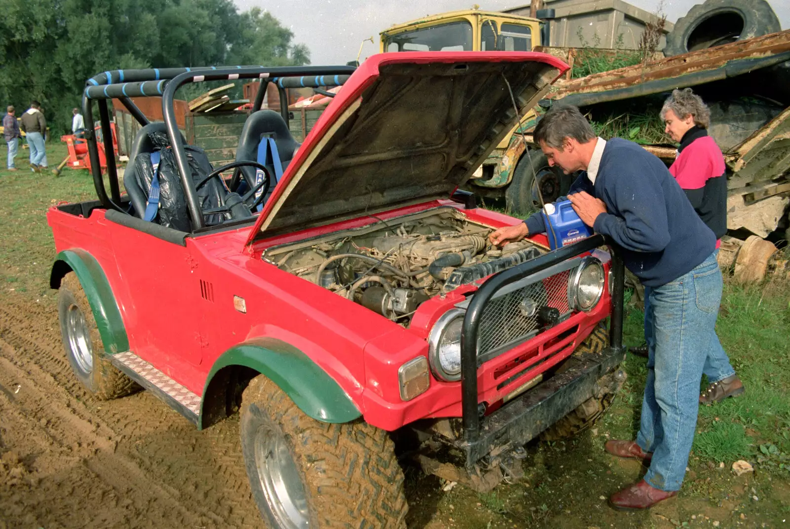 Geoff tops up with some coolant, from Off-Roading With Geoff and Brenda, Suffolk - 10th October 1994