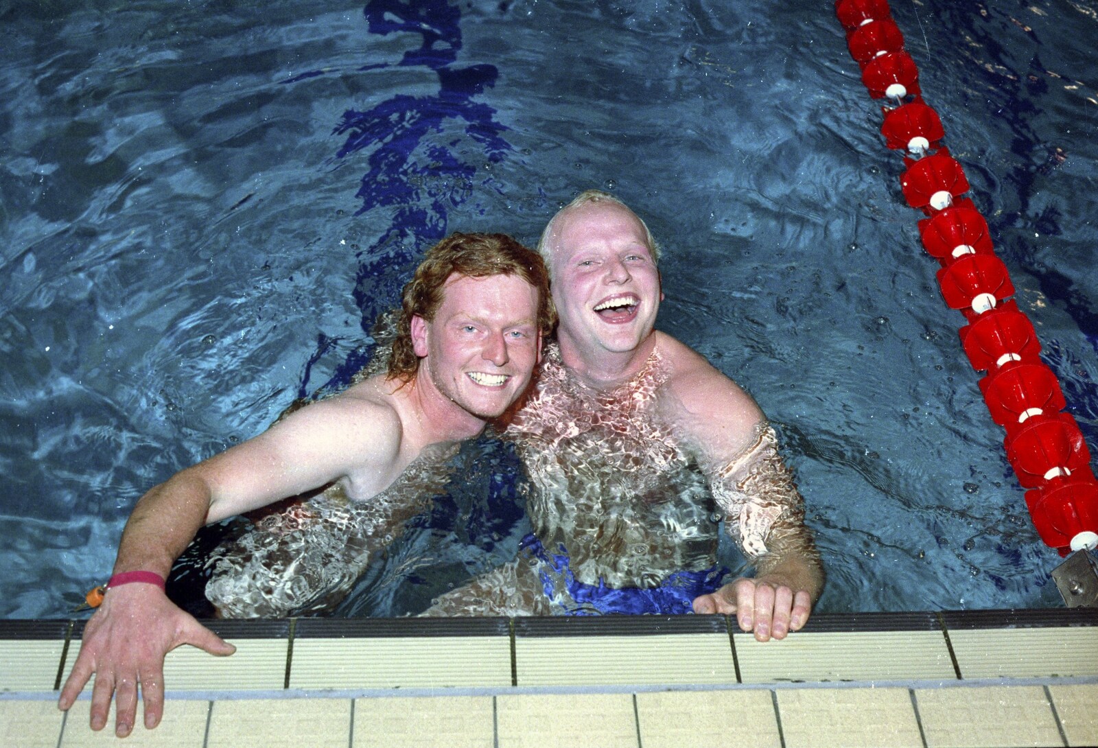 Wavy and Tim Amps have a moment from The Swan does the BHF Sponsored Swim, Diss Pool, Norfolk - 3rd October 1994