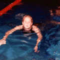 Rainey swims up to the end of the pool