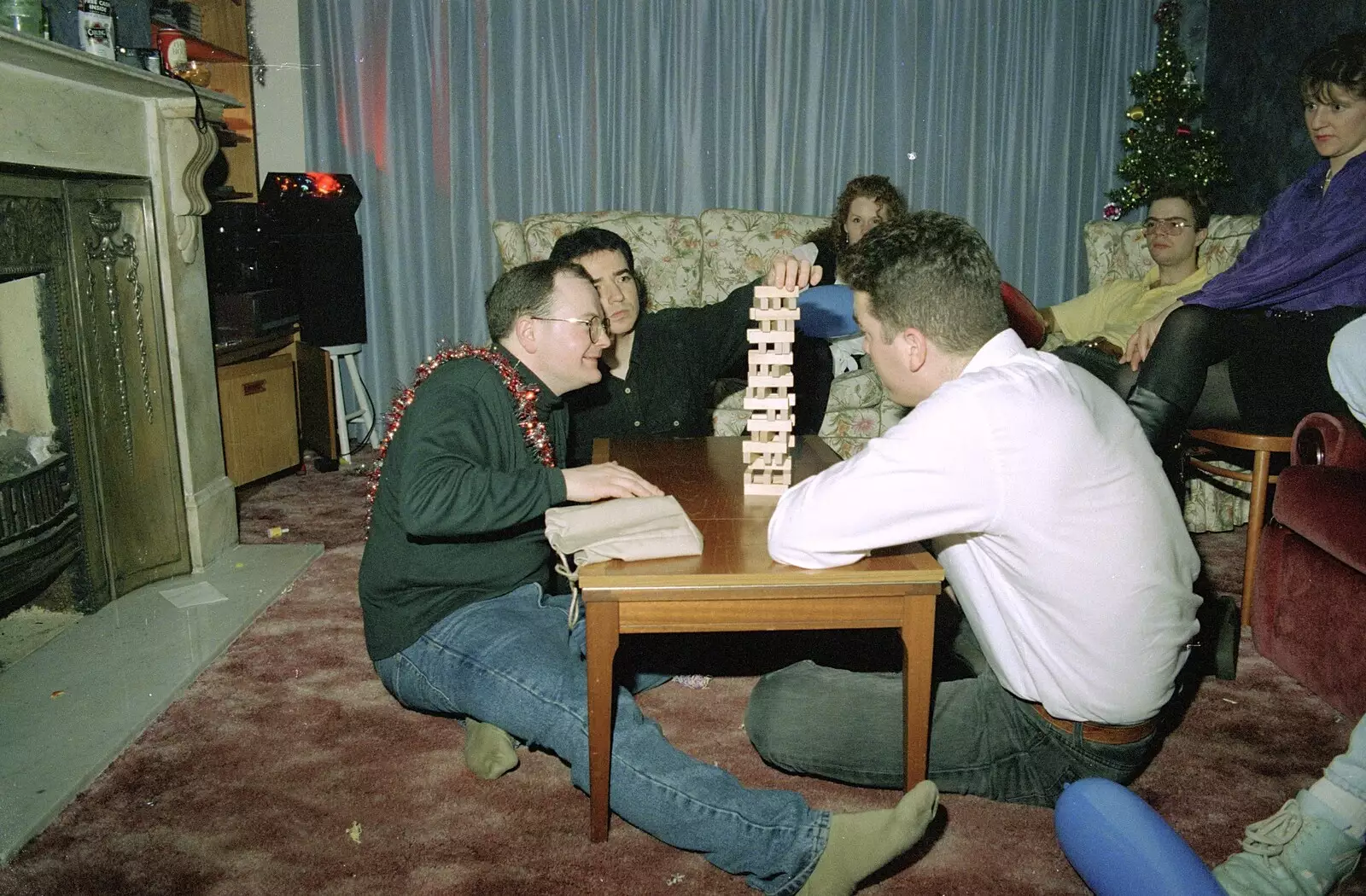 Hamish's mate carefully stacks the Jenga, from Christmas Down South, Burton and Walkford, Dorset - 25th December 1994