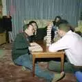 Hamish's mate carefully stacks the Jenga, Christmas Down South, Burton and Walkford, Dorset - 25th December 1994