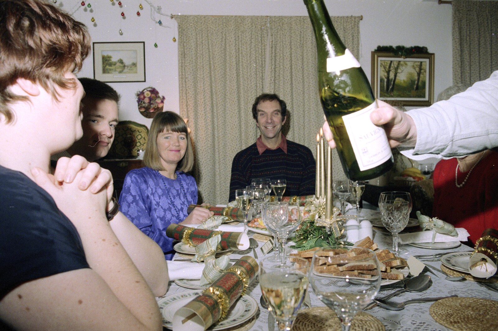Neil pours out a spot of Sauvignon from Christmas Down South, Burton and Walkford, Dorset - 25th December 1994