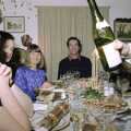 Neil pours out a spot of Sauvignon, Christmas Down South, Burton and Walkford, Dorset - 25th December 1994