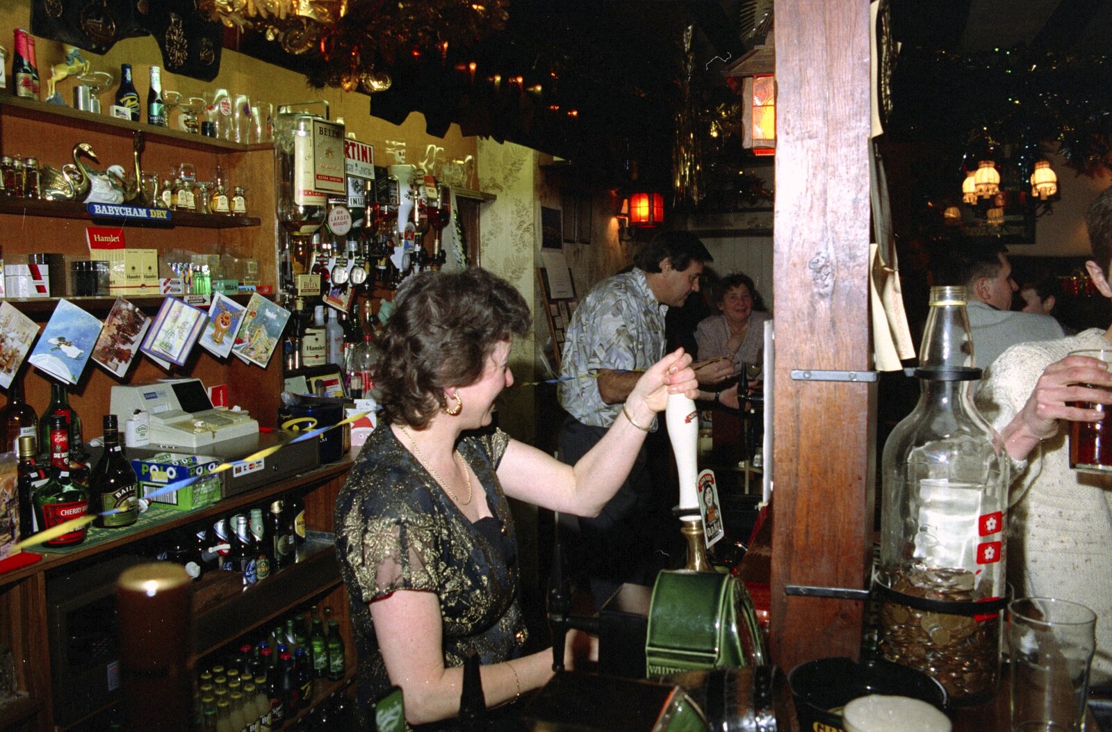 Sylvia pulls a pint from New Year's Eve at the Swan Inn, Brome, Suffolk - 31st December 1994