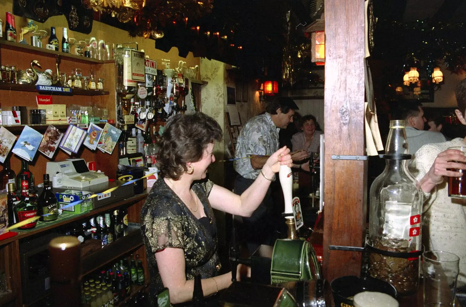 Sylvia pulls a pint, from New Year's Eve at the Swan Inn, Brome, Suffolk - 31st December 1994