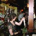 Sylvia pulls a pint, New Year's Eve at the Swan Inn, Brome, Suffolk - 31st December 1994