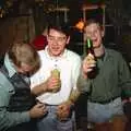 Mikey holds up a bottle of Pils, New Year's Eve at the Swan Inn, Brome, Suffolk - 31st December 1994