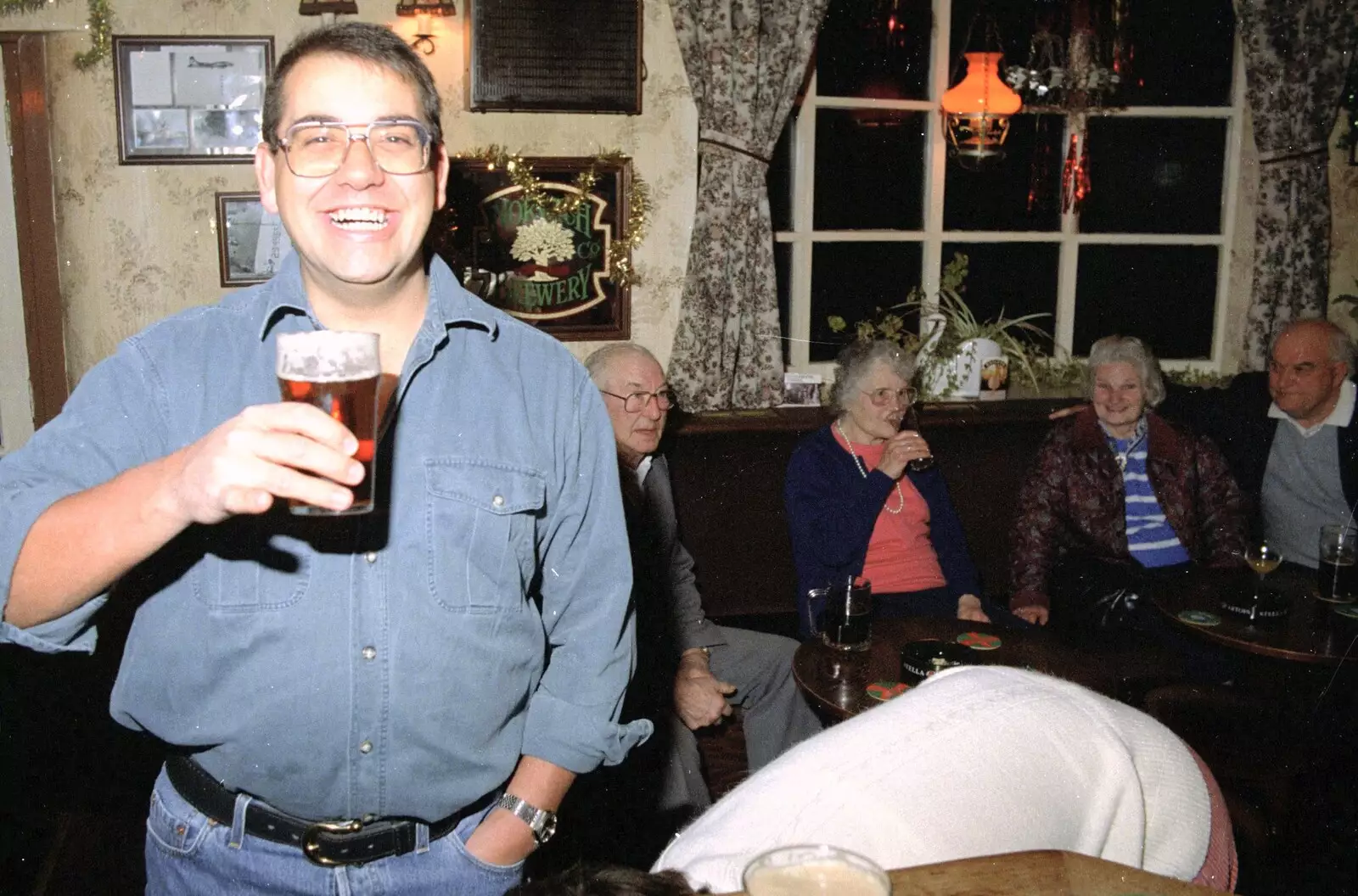 Roger holds a beer up as Pippa ducks, from New Year's Eve at the Swan Inn, Brome, Suffolk - 31st December 1994