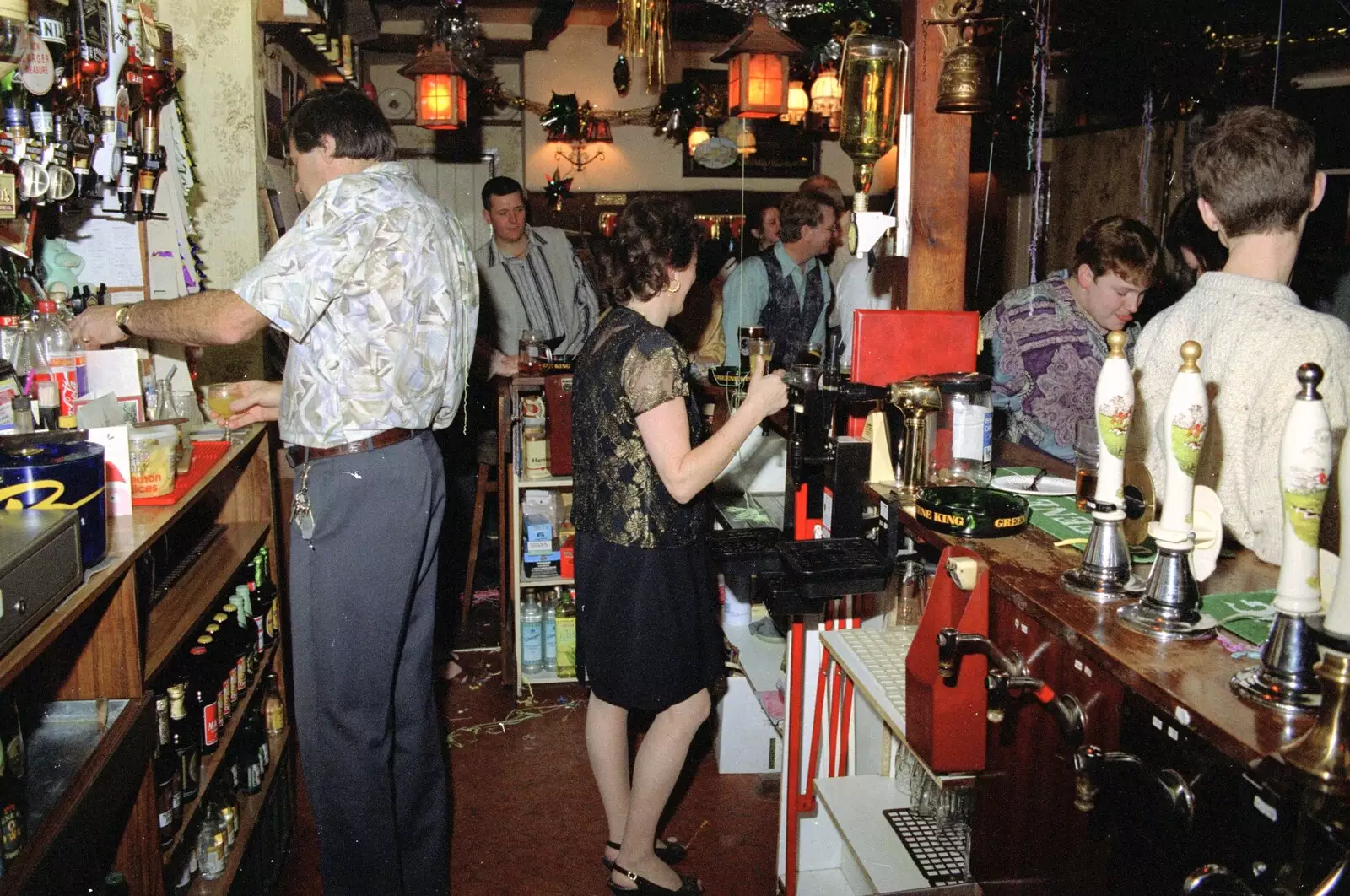 More behind the bar, from New Year's Eve at the Swan Inn, Brome, Suffolk - 31st December 1994