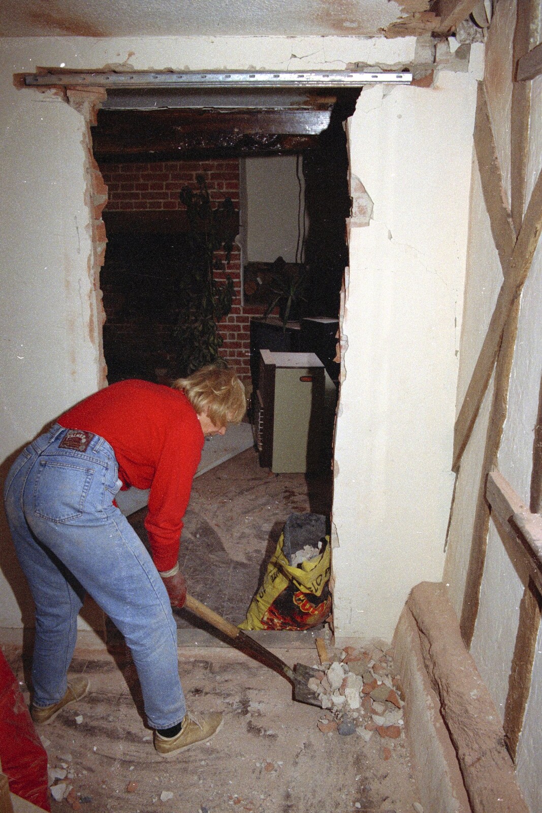Katie clears away some rubble from A Phil and Sean Weekend, and Bedroom Building, Brome, Norwich and Southwold - 18th April 1995