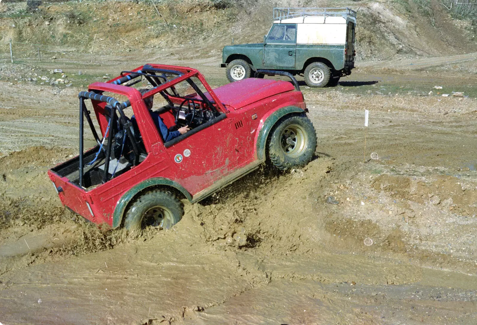 Powering out of a muddy pond, from Off-Roading and The Swan Inn, Brome, Suffolk - 20th May 1995