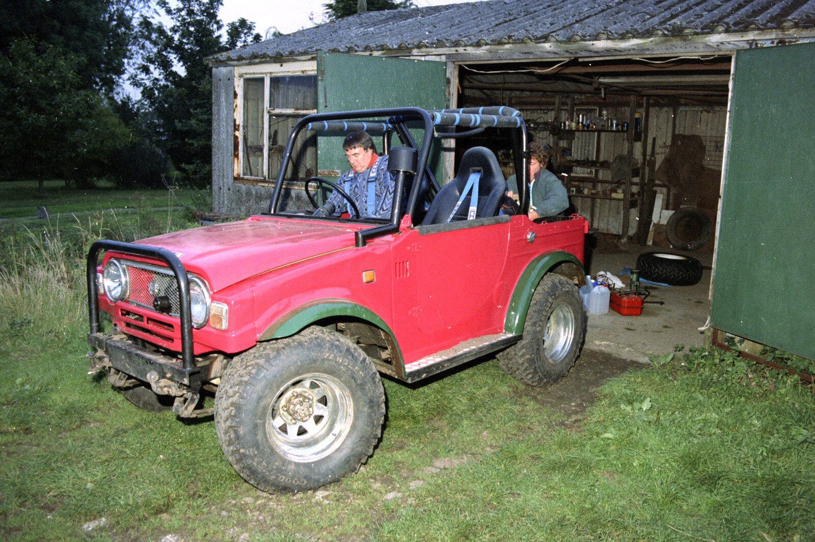Corky drives the Daihatsu out of the garage from Off-roading with Geoff and Brenda, Stuston and Elsewhere, Suffolk - 15th September 1995
