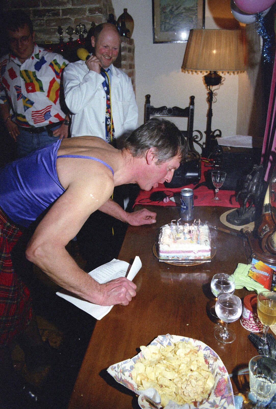 Geoff blows out the birthday candles from Geoff's Birthday, Stuston, Suffolk - 18th December 1995