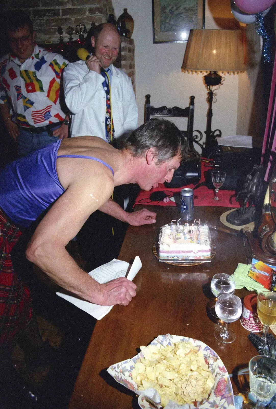 Geoff blows out the birthday candles, from Geoff's Birthday, Stuston, Suffolk - 18th December 1995