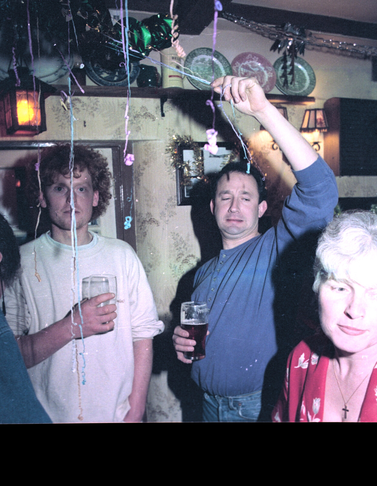 DH isn't sure about some streamers from New Year's Eve in the Swan Inn, Brome, Suffolk - 31st December 1995