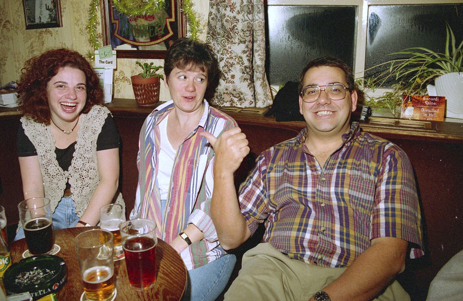 Roger points his thumb at some friends from New Year's Eve in the Swan Inn, Brome, Suffolk - 31st December 1995