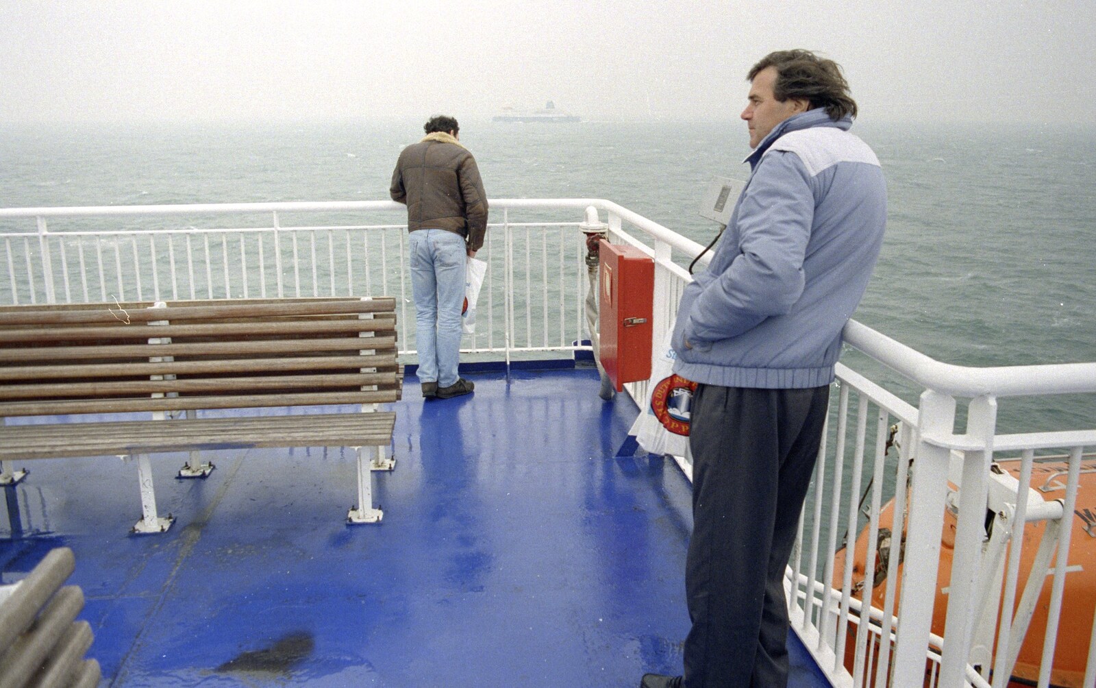 Alan looks out to sea as DH peers over the side from The CISU Internet Team, Bedroom Building and Ferries, Suffolk - 16th February 1996