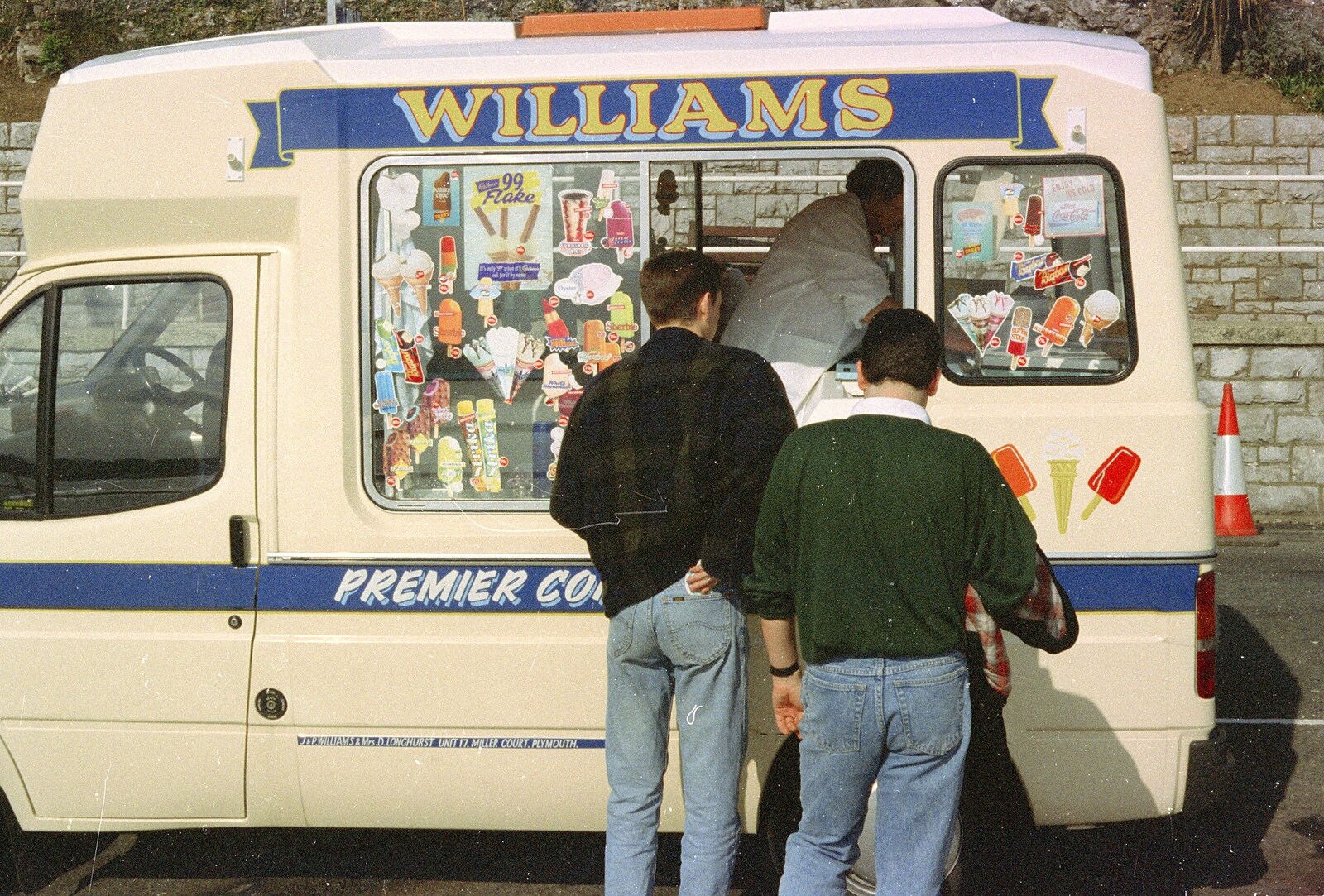 Andrew and Russell queue up for ice creams from Uni: A CISU Trip To Plymouth, Devon - 16th March 1996