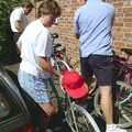 Pippa hauls her bike out as we set off, The First BSCC Bike Ride to Southwold, Suffolk - 10th June 1996