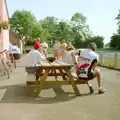 A discussion of tactics outside the Swan, The First BSCC Bike Ride to Southwold, Suffolk - 10th June 1996