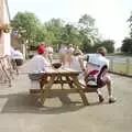 A discussion of tactics outside the Swan, The First BSCC Bike Ride to Southwold, Suffolk - 10th June 1996