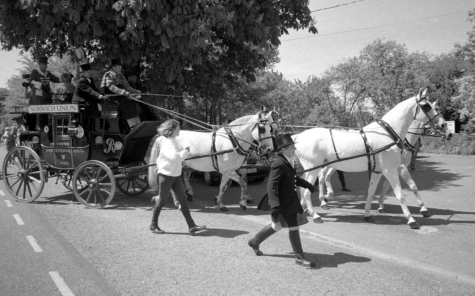 The coach and four enters the pub car park, from The Norwich Union Mail Coach Run, The Swan Inn, Brome - 15th June 1996